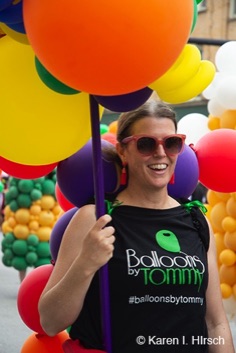 Female with multi-colored balloons